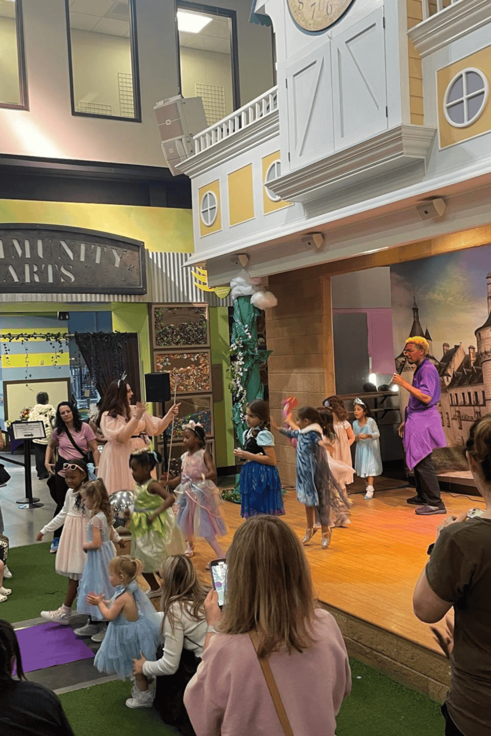 A magical storytime event featuring children in fairy tale costumes on a stage at Quest for Directions.