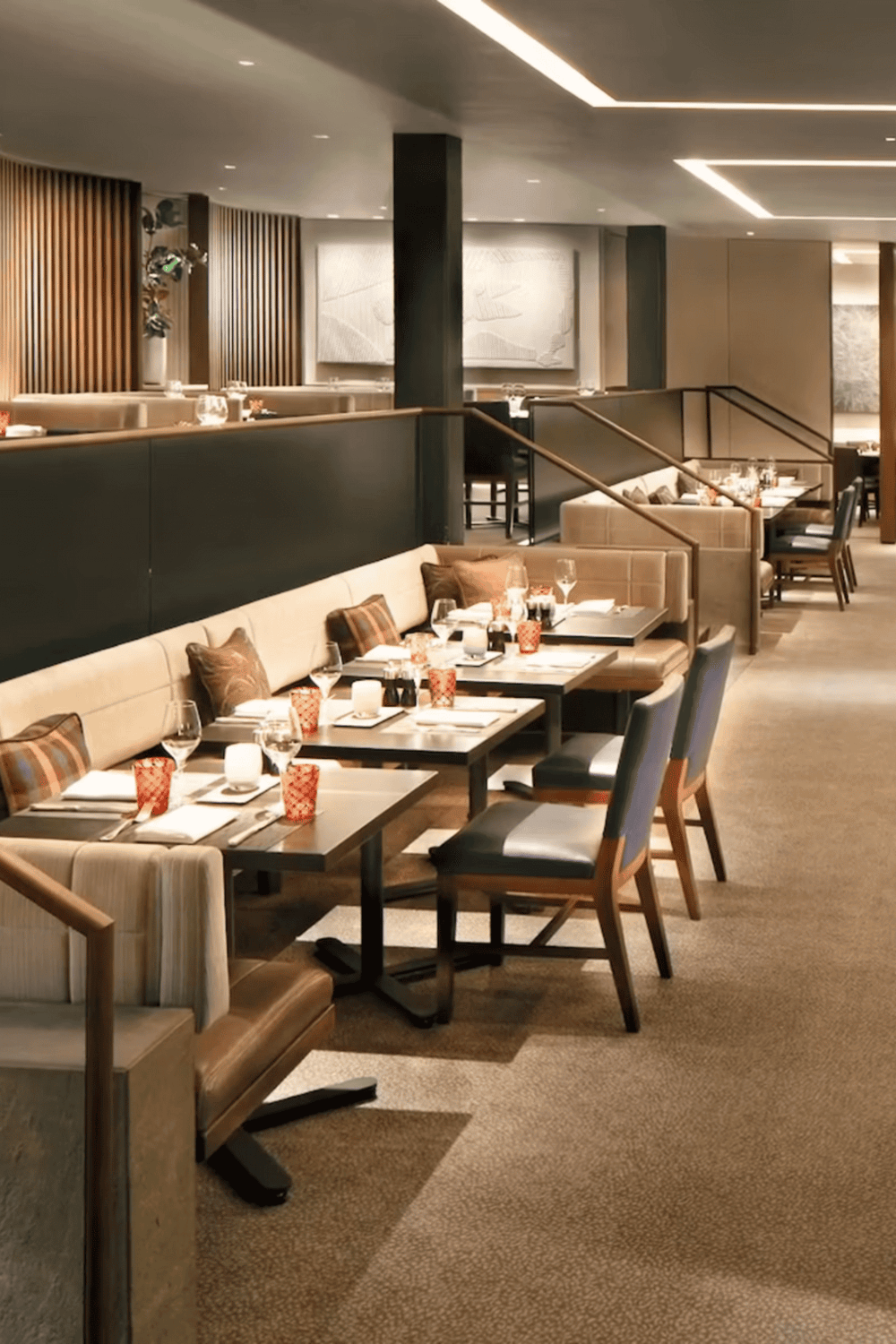 Cozy upscale restaurant with elegant table settings and modern decor for fine dining.