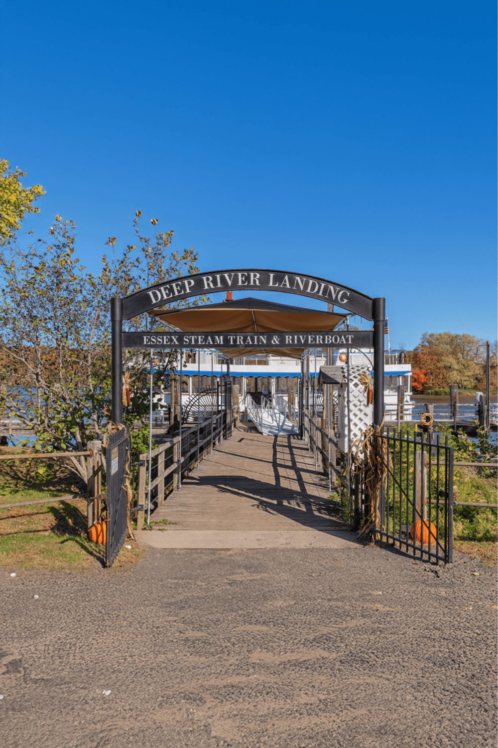 1. Deep River Landing Essex steam train and riverboat dock at local river in autumn.