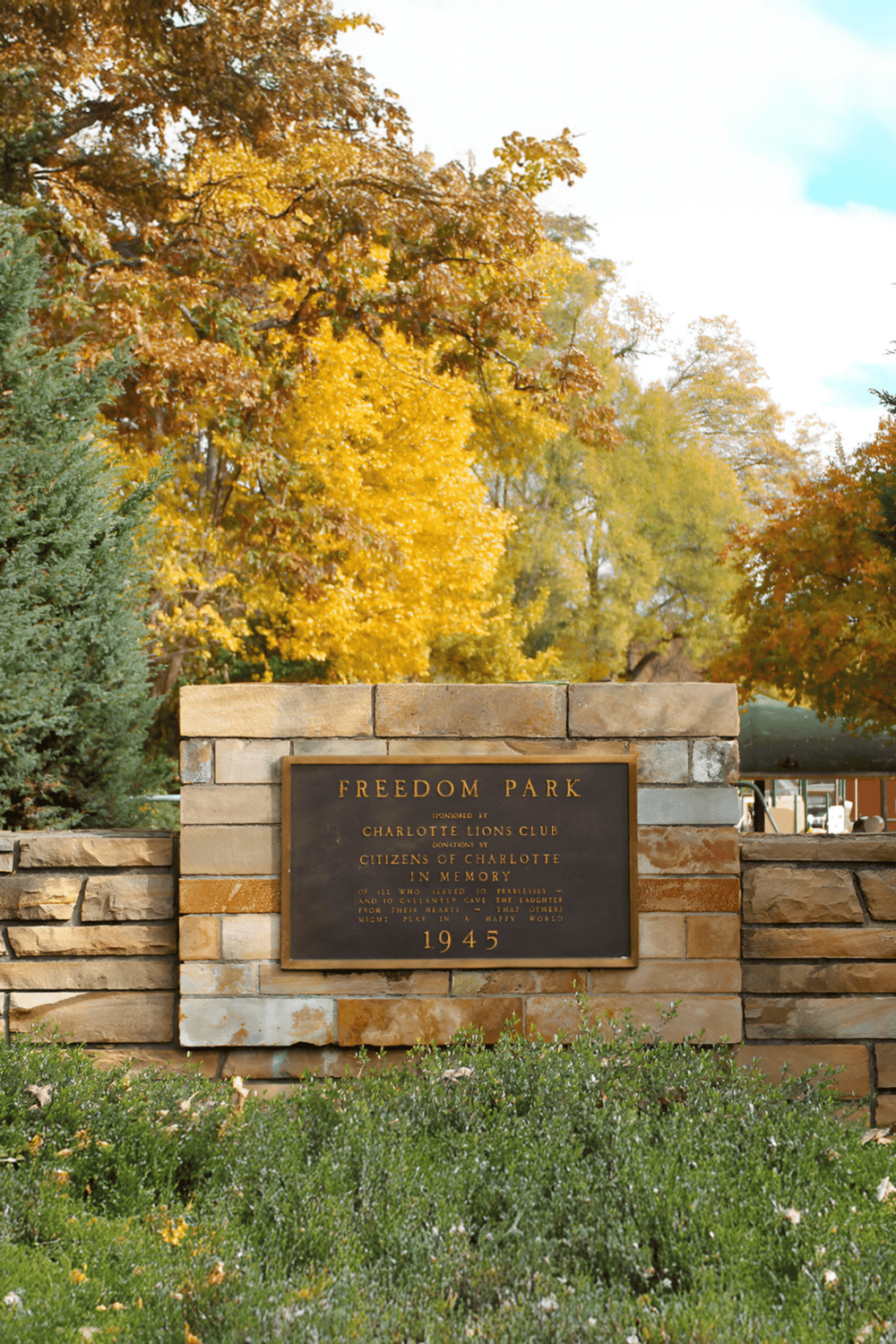 Colorful fall scenery at Freedom Park with historic memorial plaque, perfect for outdoor exploration.