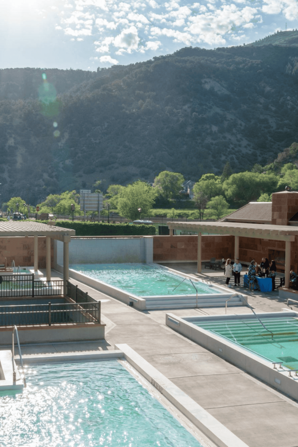 Natural hot springs with mountain views and outdoor pool at QuestForDirections, healing ambiance and scenic landscape.