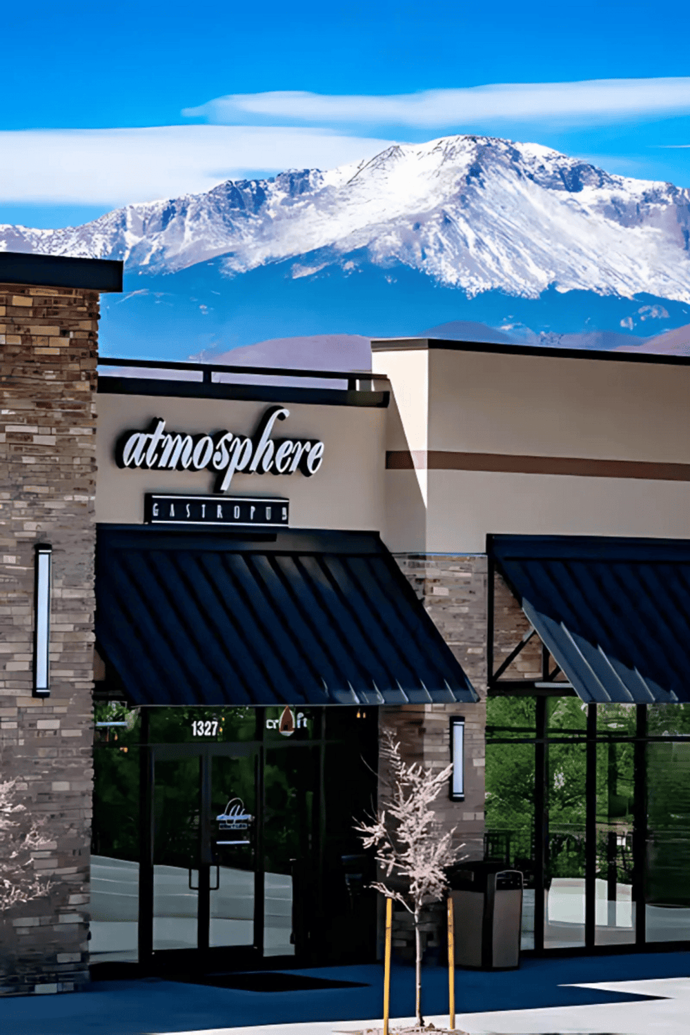 A1. Modern bistro restaurant with mountain view in the background.