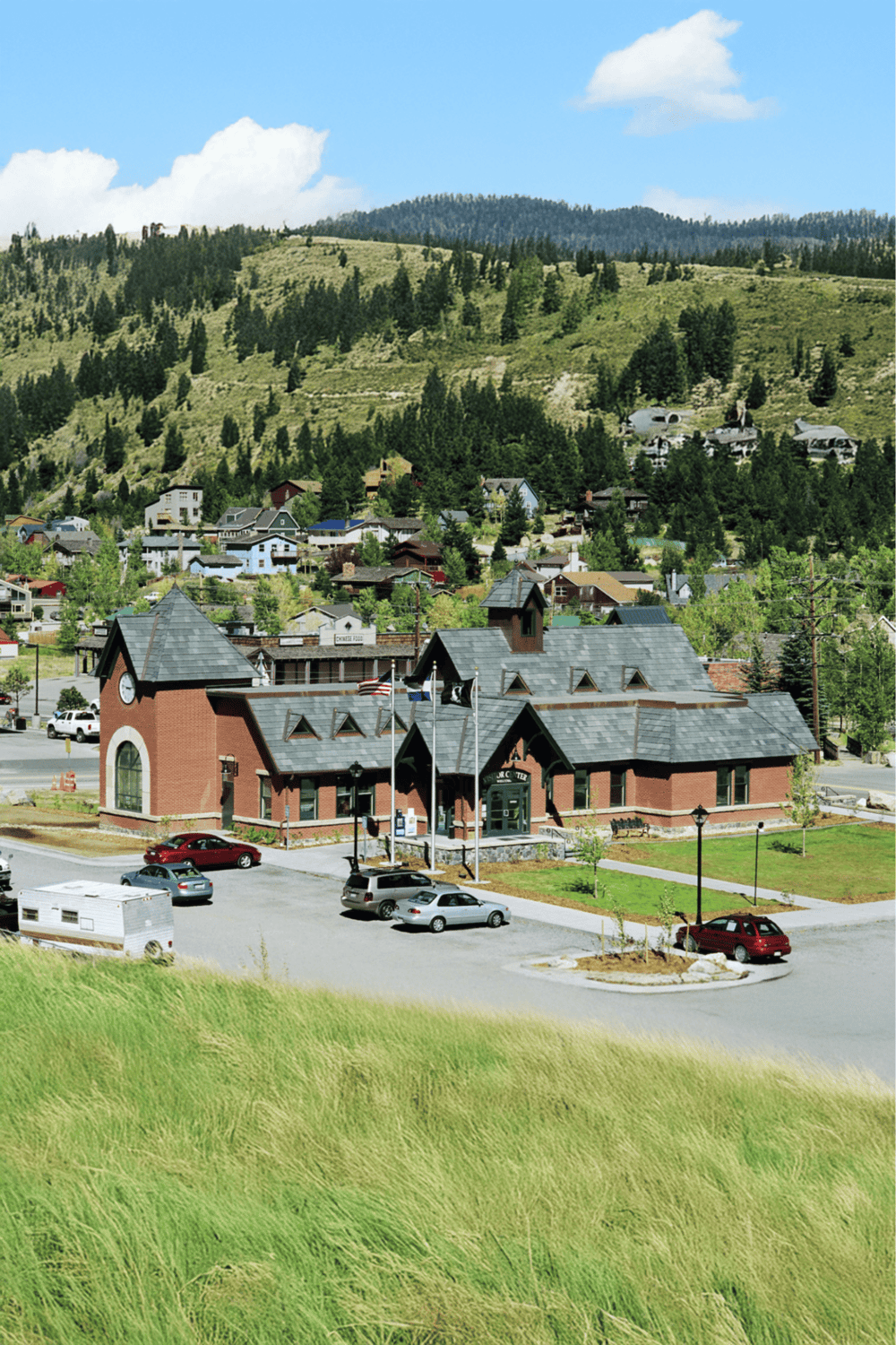 Scenic mountain town with colorful houses and a historic building, ideal for outdoor adventures and travel planning.