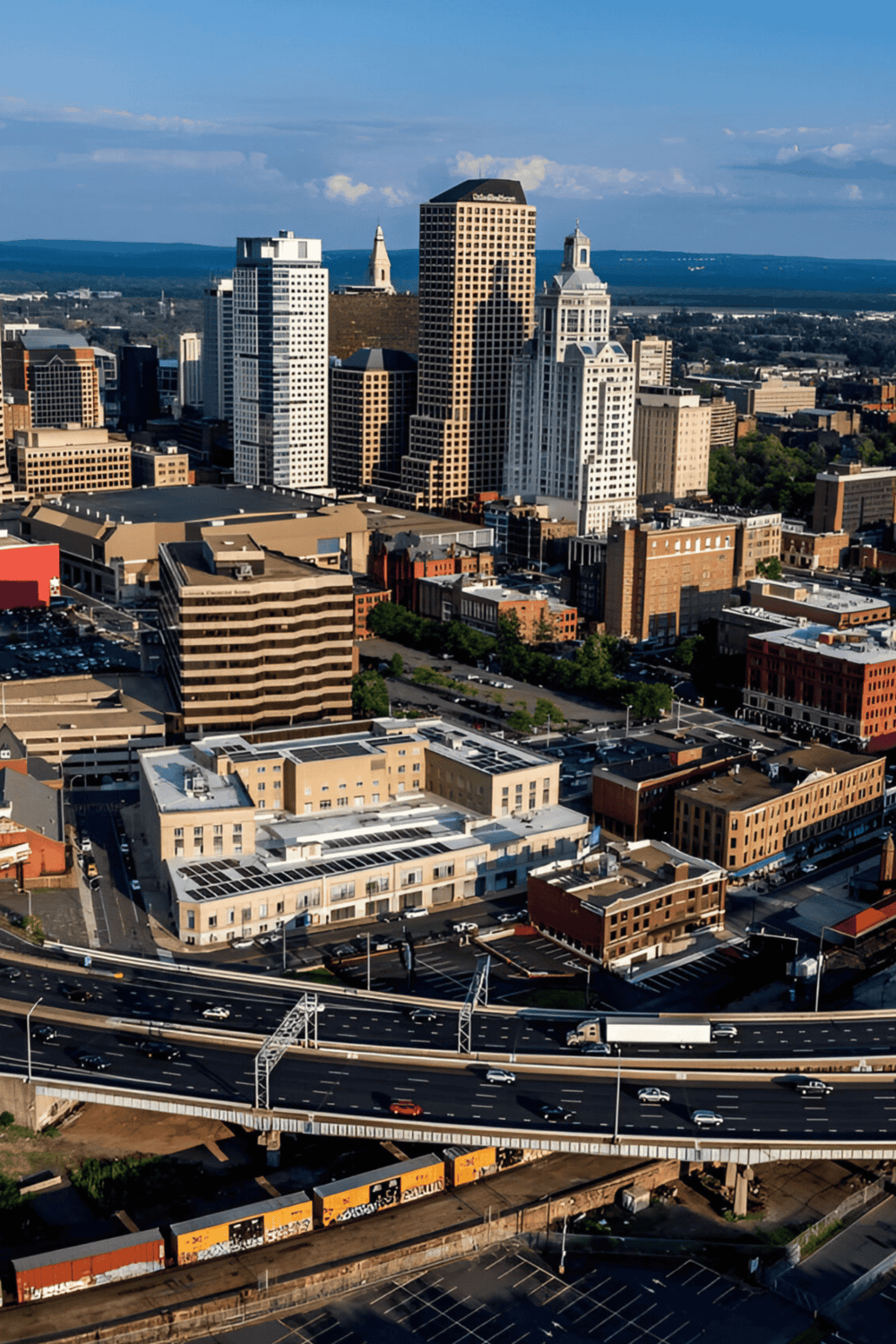 Downtown cityscape with skyscrapers, highways, and urban infrastructure in QuestForDirections image.