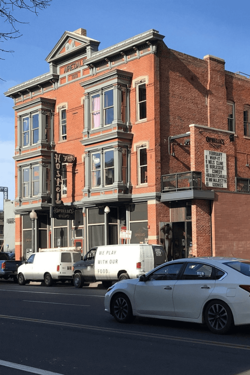 Historic brick building with theater signage, part of Quest for Directions' local event promotion.
