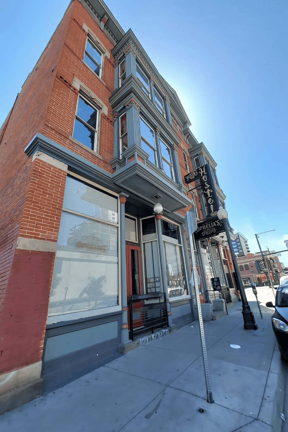 Charming historic hotel building with Victorian architectural details in downtown area.