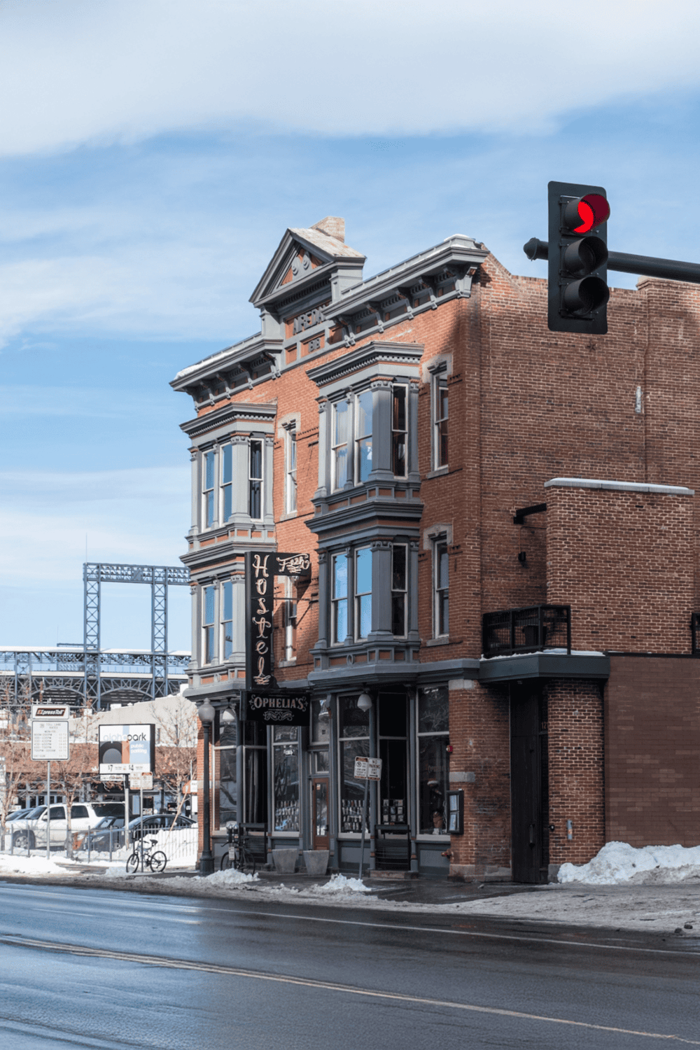 Old historic building with Victorian architecture, on a city street with snow.