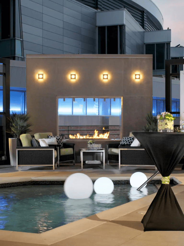 Luxury rooftop lounge with fire pit and modern decor at QuestForDirections.