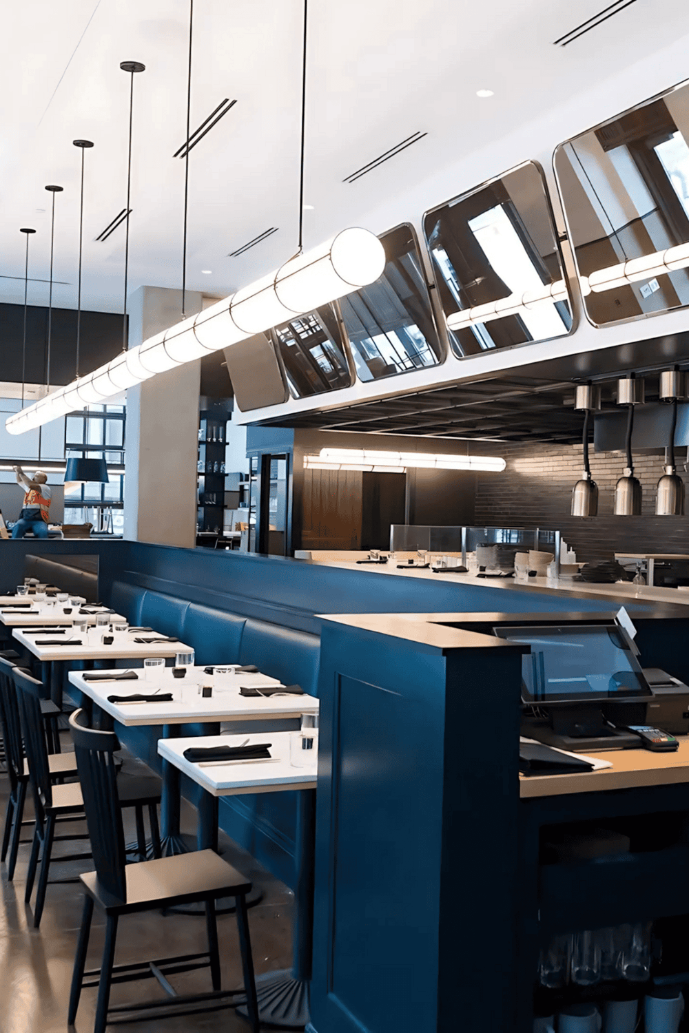 Modern restaurant interior with sleek lighting and stylish décor.
