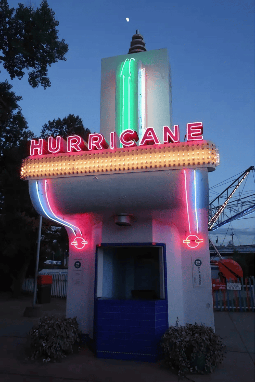 Neon hurricane sign at dusk, bright colorful lights, vintage roadside attraction, photo of neon sign, retro theme, travel destination, neon art.