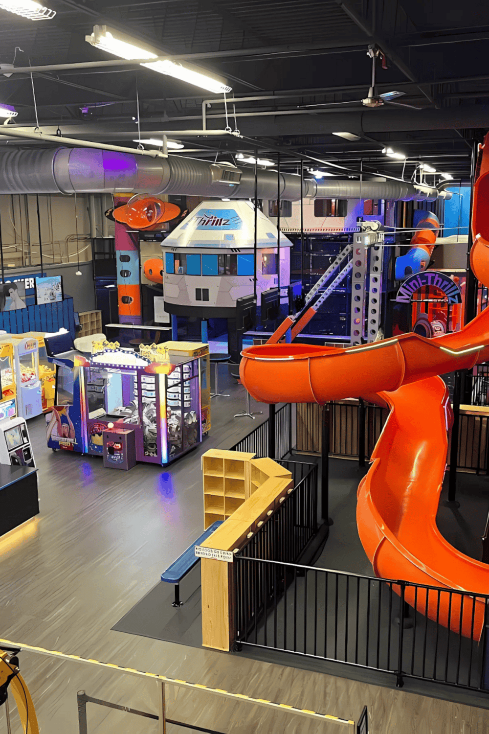 Indoor family fun at Quest for Directions amusement center with slides and arcade games.