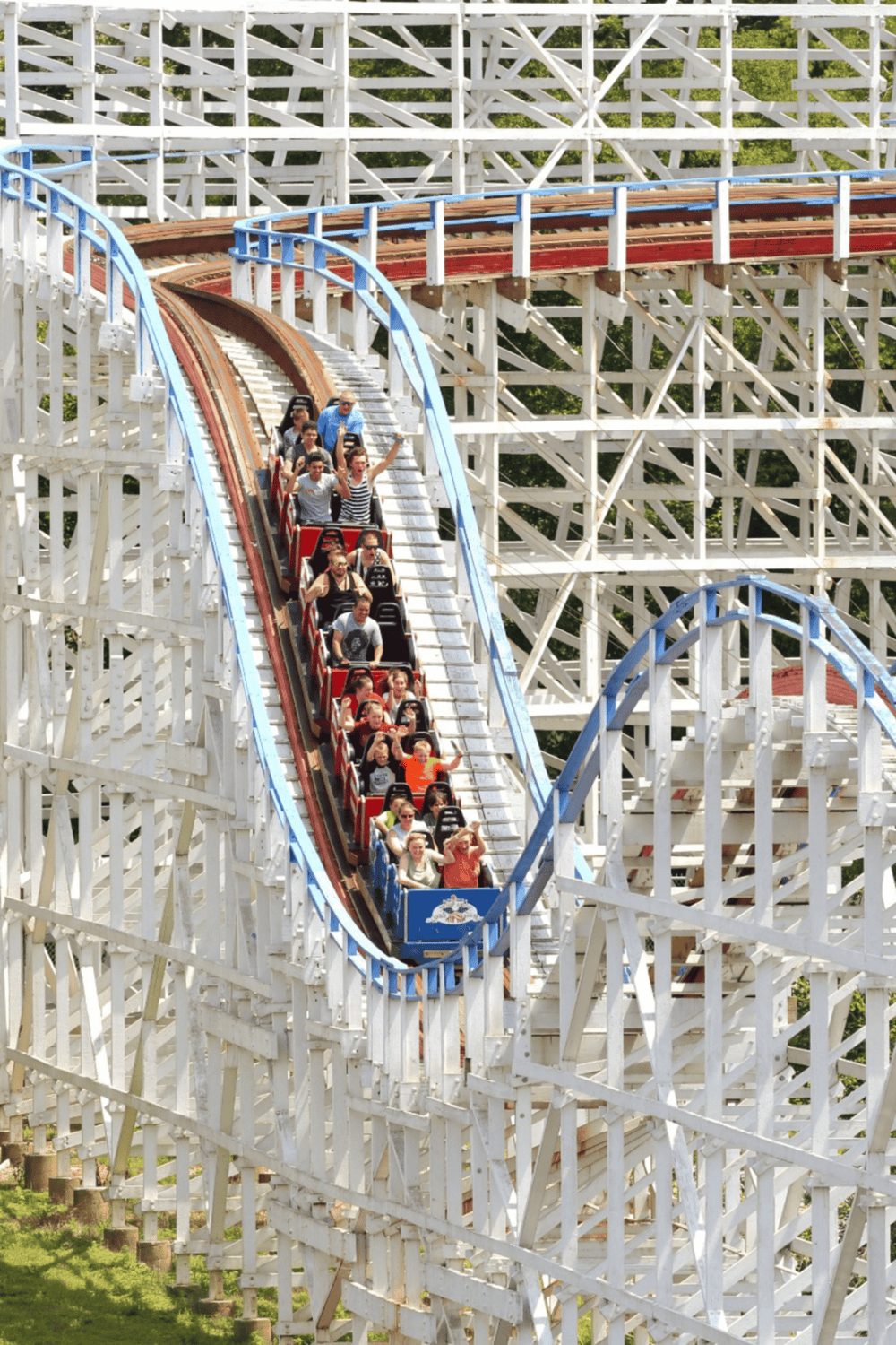 Thrilling wooden roller coaster ride at QuestForDirections amusement park, family fun and exhilarating thrills.