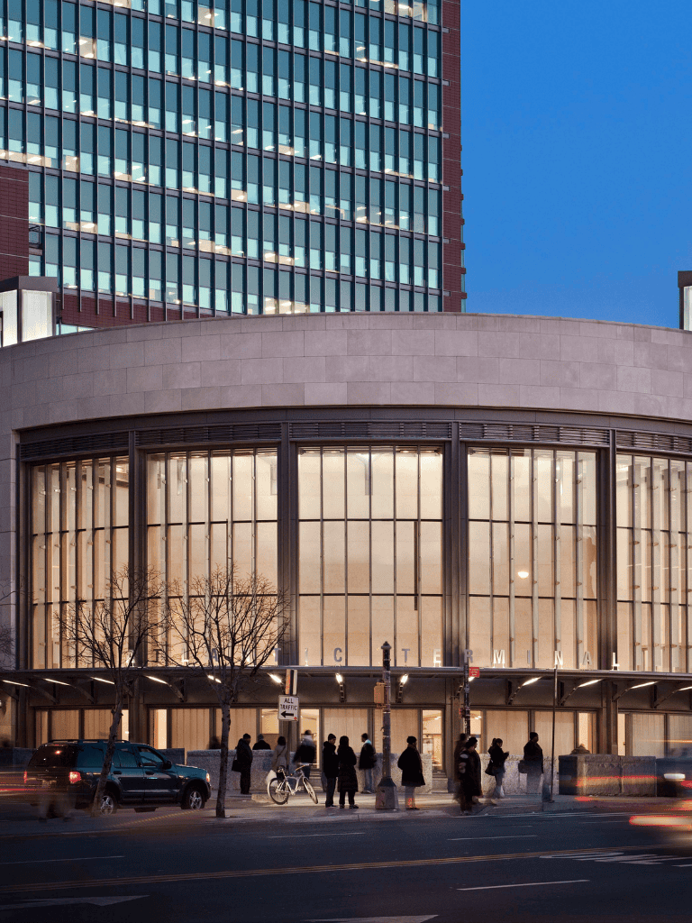 Modern urban cityscape with high-rise buildings and bustling street scene in downtown.