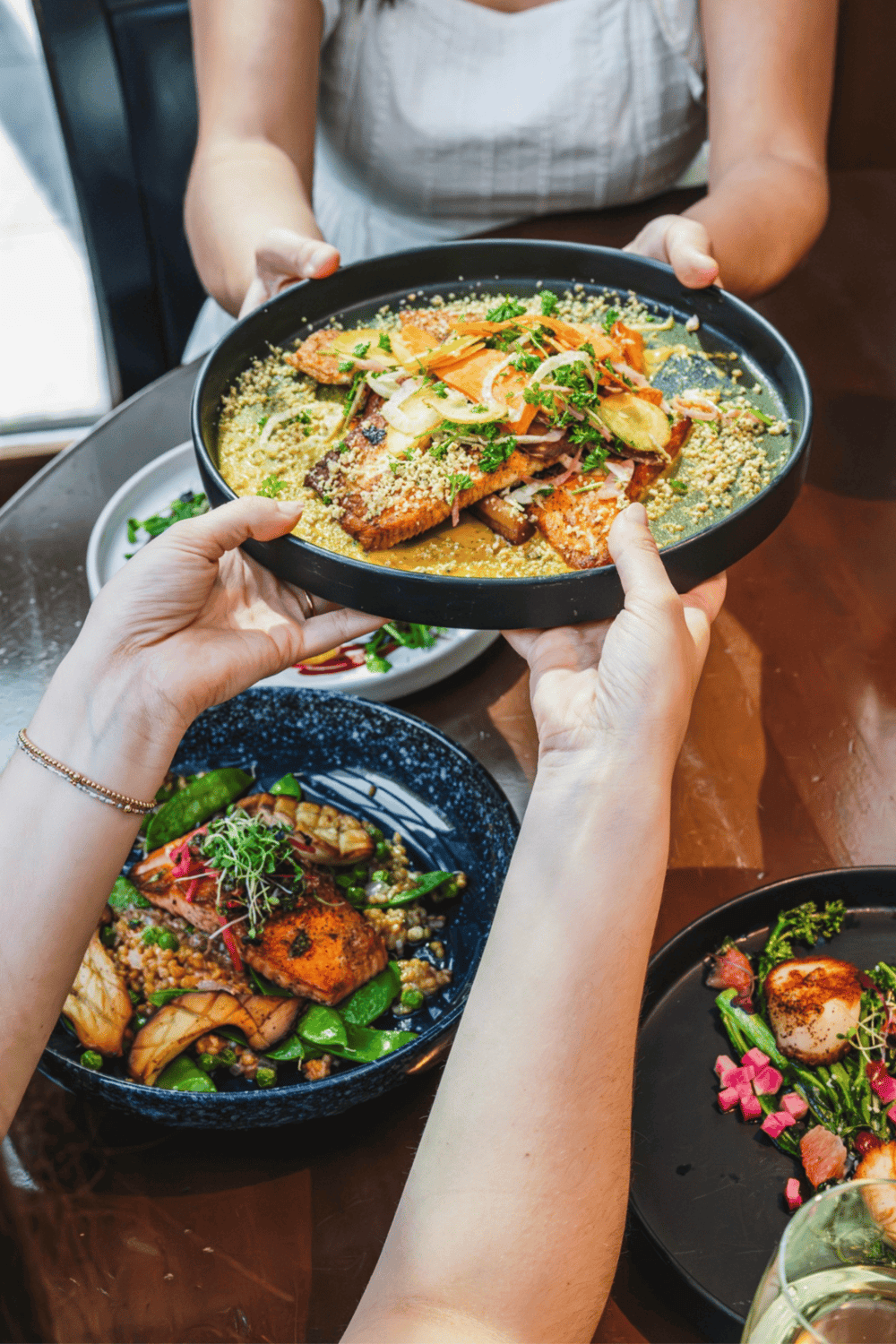 Steak and vegetable dish at Asian restaurant, gourmet cuisine for dinner, plated beautifully with fresh herbs.