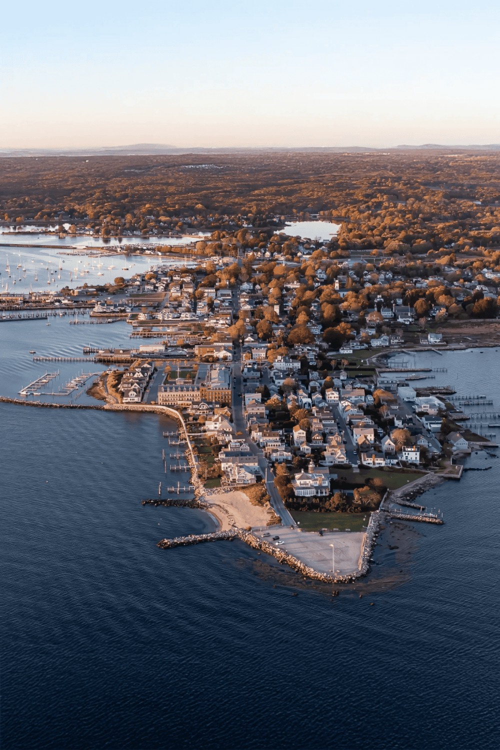 Coastal town with marina, waterfront homes, and scenic harbor views, perfect for travel and exploration.