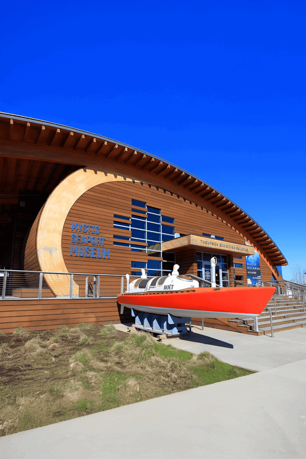 Bright modern Marvel at Mystic Seaport Museum with boat display and unique architecture.