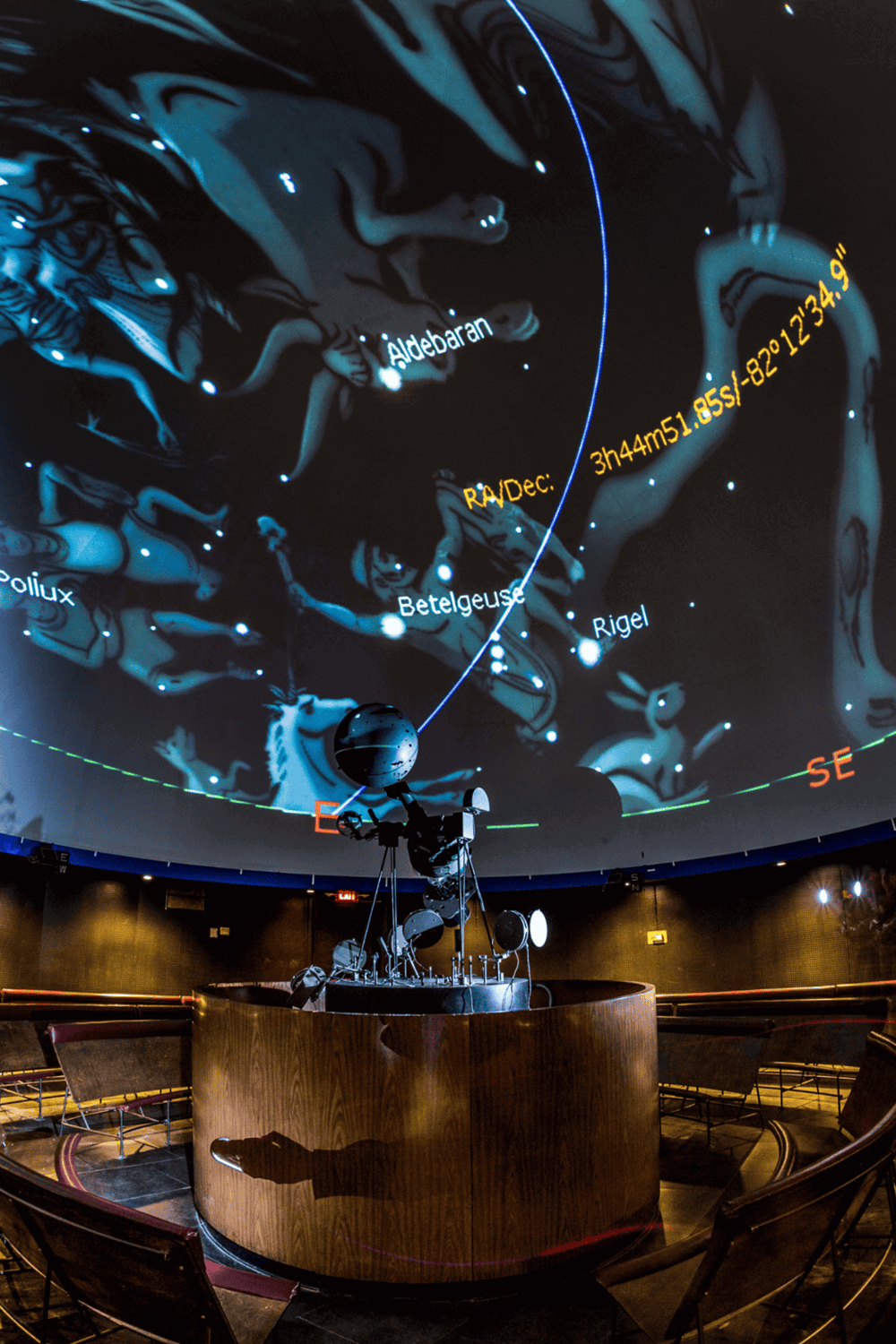 Earth and moon exhibit with star map projection at QuestForDirections exhibit.