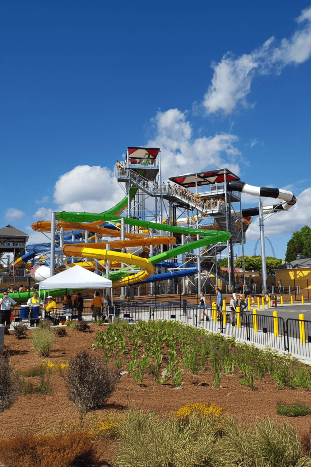 Colorful outdoor water park slides at QuestForDirections amusement park during sunny day.