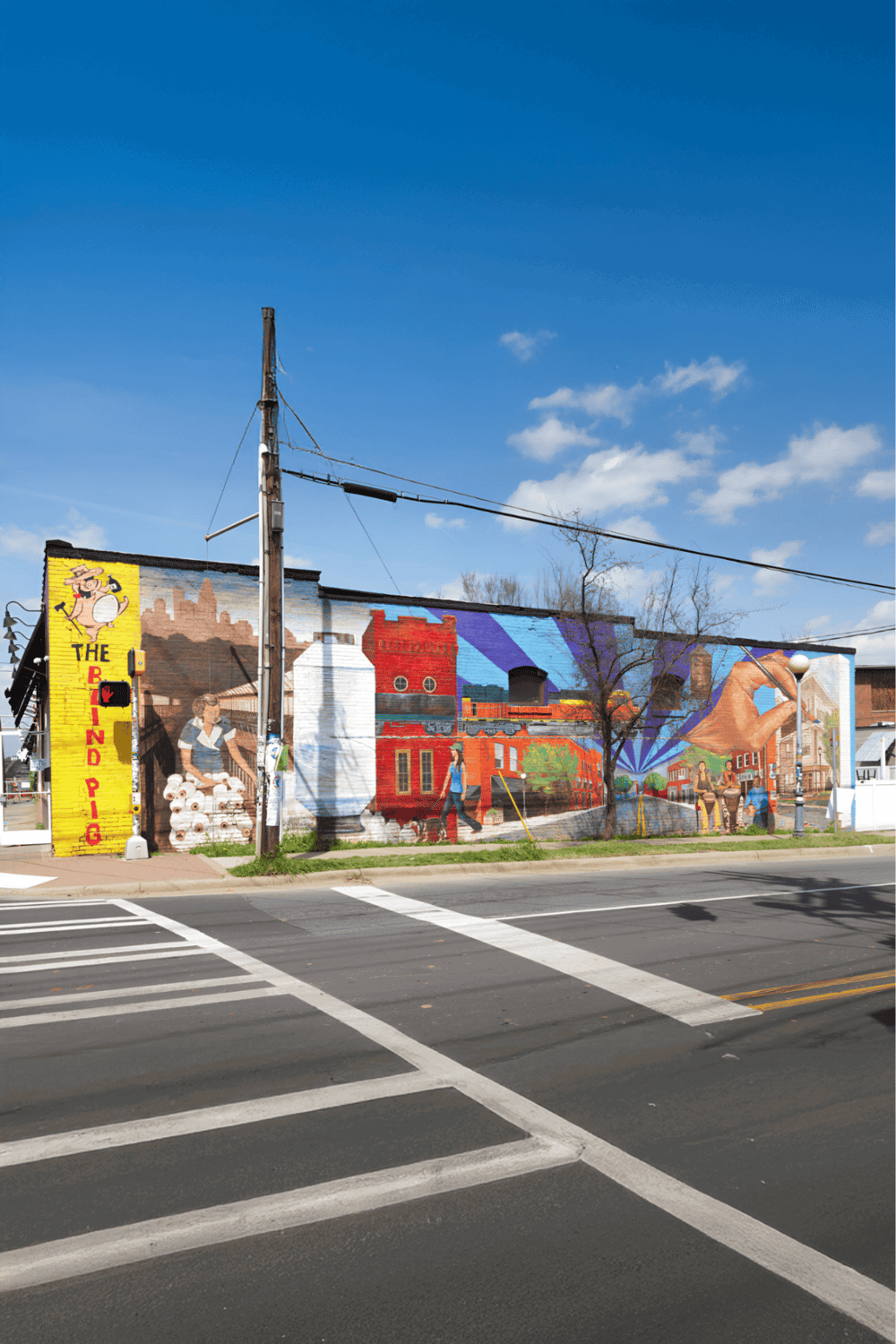 Colorful mural on urban building showcasing community art and local culture.