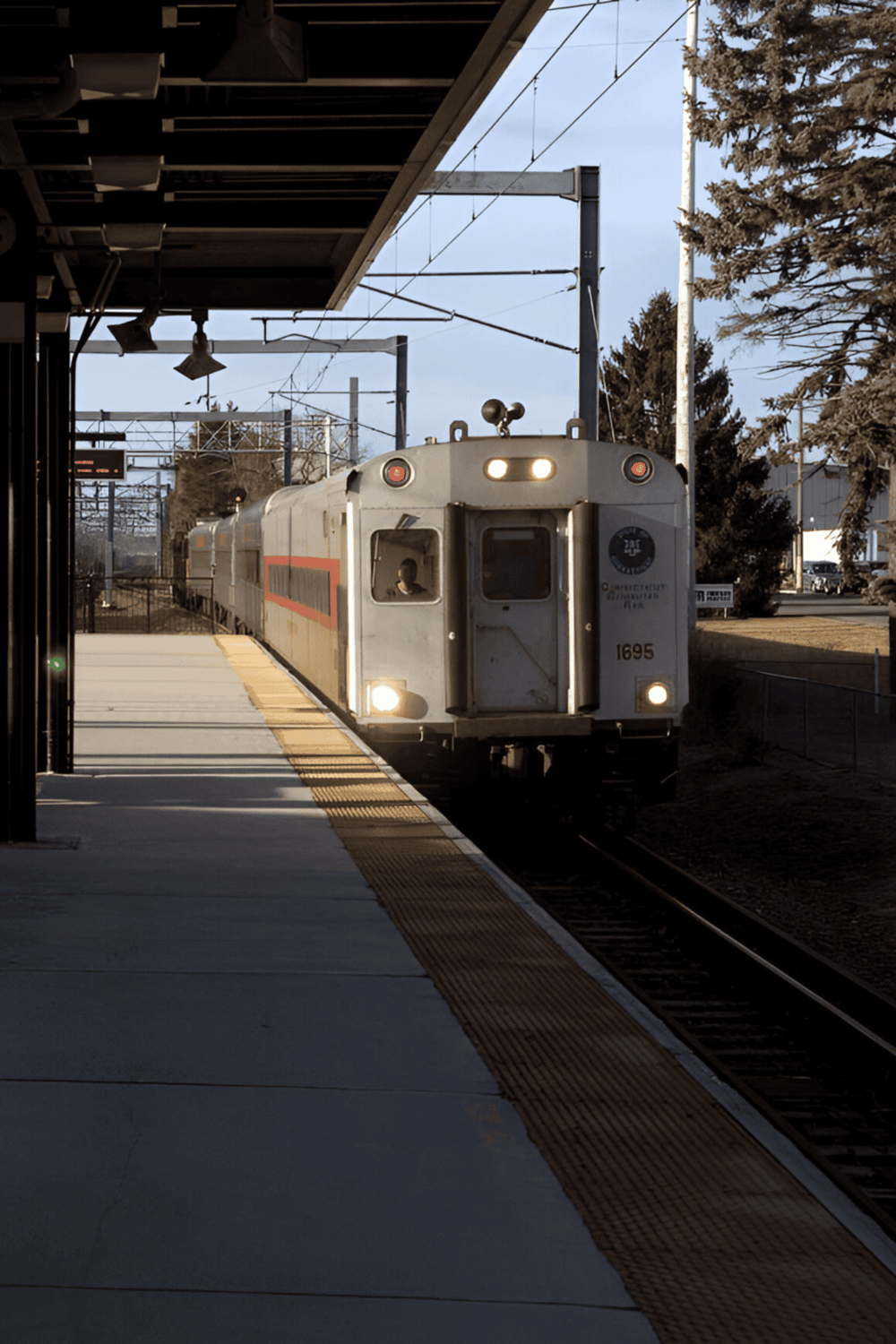 1. Commuter train arriving at station for public transportation travel.