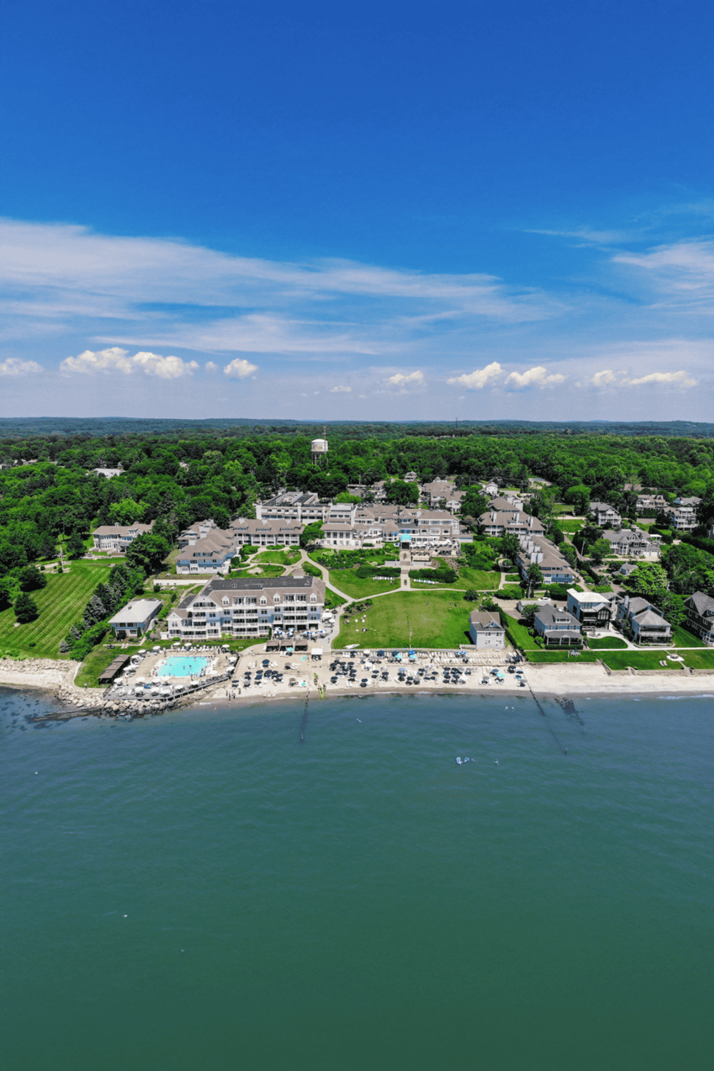 Waterfront resort with swimming pools and lush greenery at QuestForDirections.