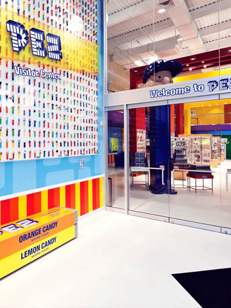 Bright colorful child-friendly interior of PEZ visitor center at QuestForDirections, fun family destination for PEZ candy fans.