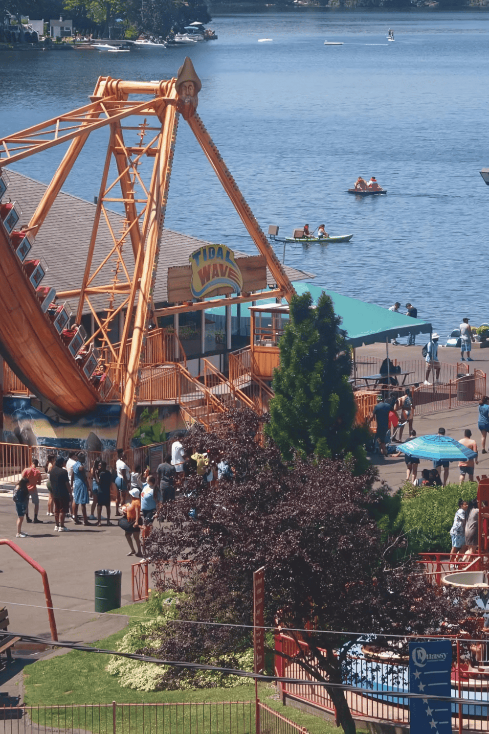 Thrilling water rides at Quest for Directions amusement park on a waterfront lake.
