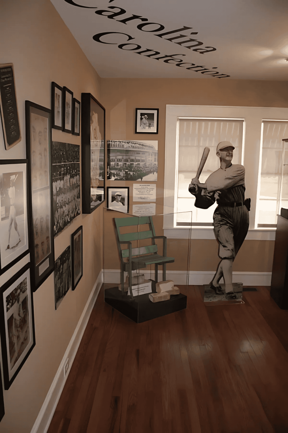 Vintage baseball player photo display with sports memorabilia and historical photos, part of QuestForDirections exhibit.