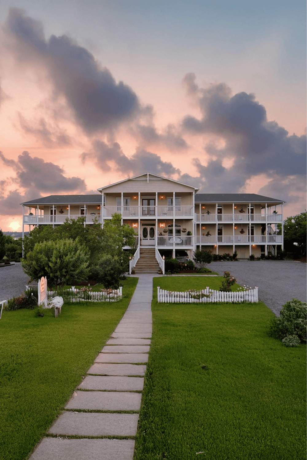 Charming beach house with multiple porches, perfect for coastal vacation stays and relaxation.