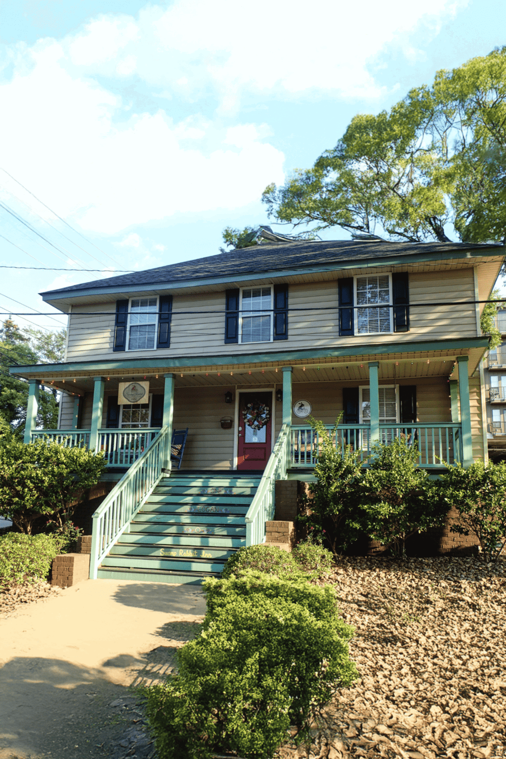 Cozy house with vibrant garden and staircase, perfect for finding directions on QuestForDirections.