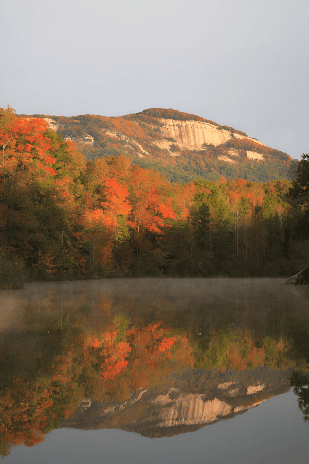Colorful autumn landscape at QuestForDirections, mountain view, with vibrant fall foliage reflections.