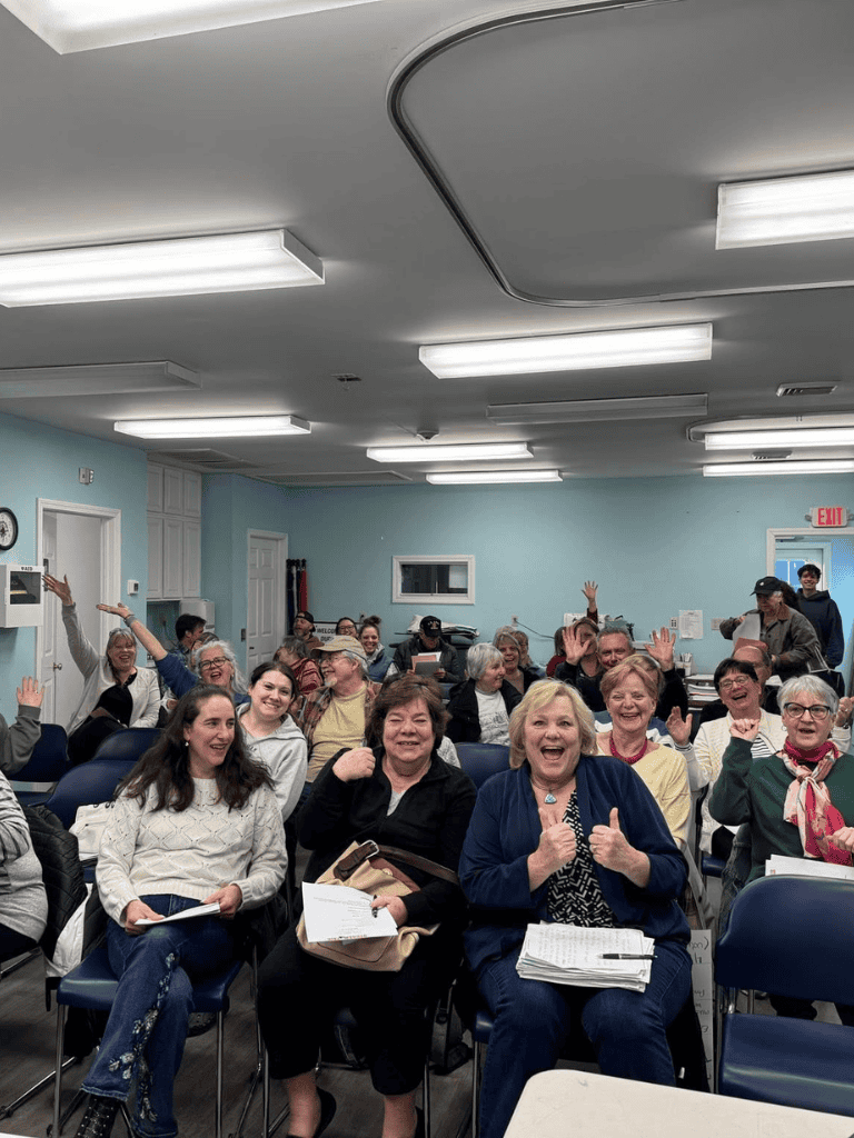 Engaged group of women participating in a community event at QuestForDirections conference.