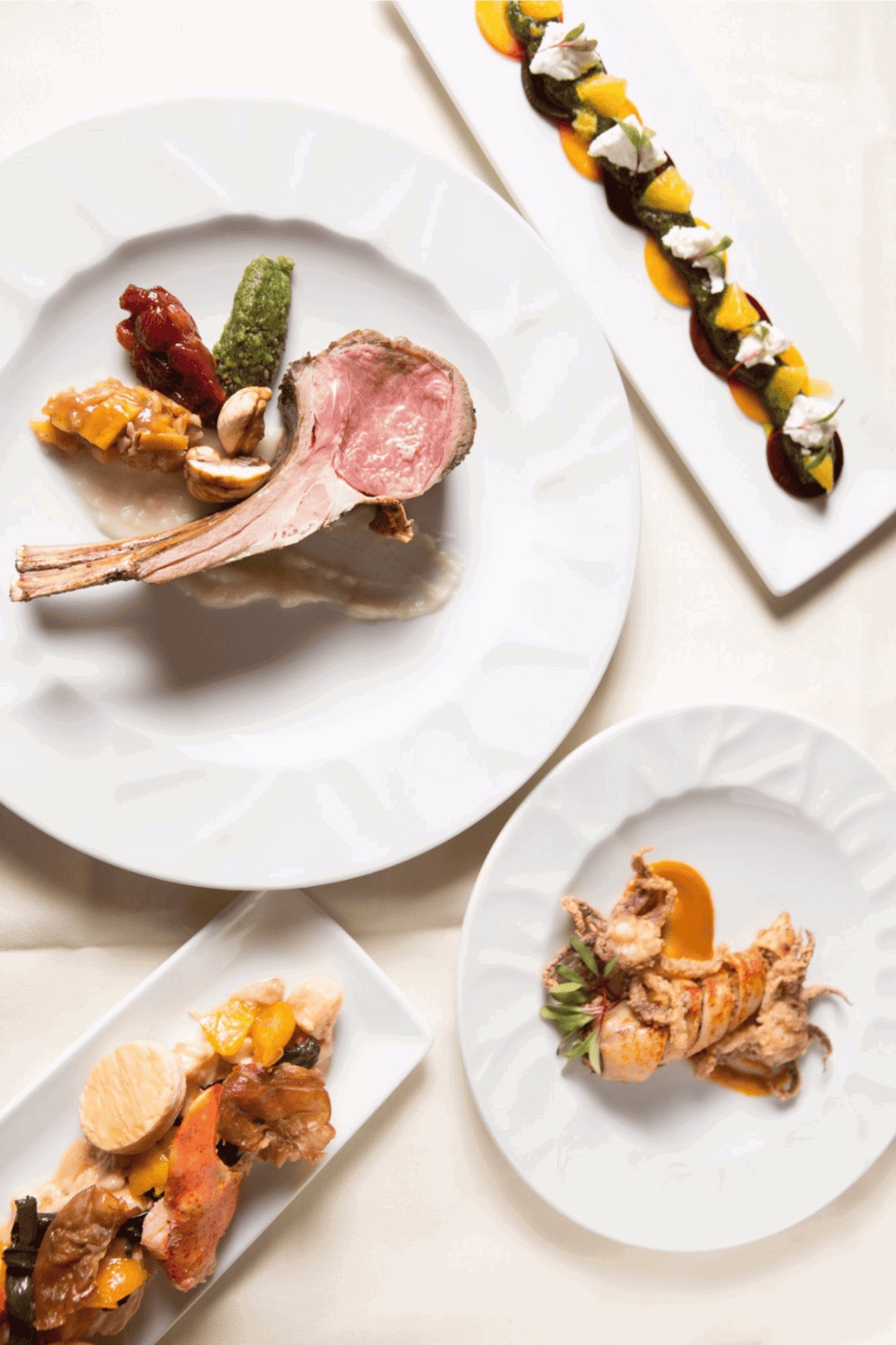 Elegant gourmet restaurant dishes with lamb, seafood, and vegetable plating for fine dining experiences.