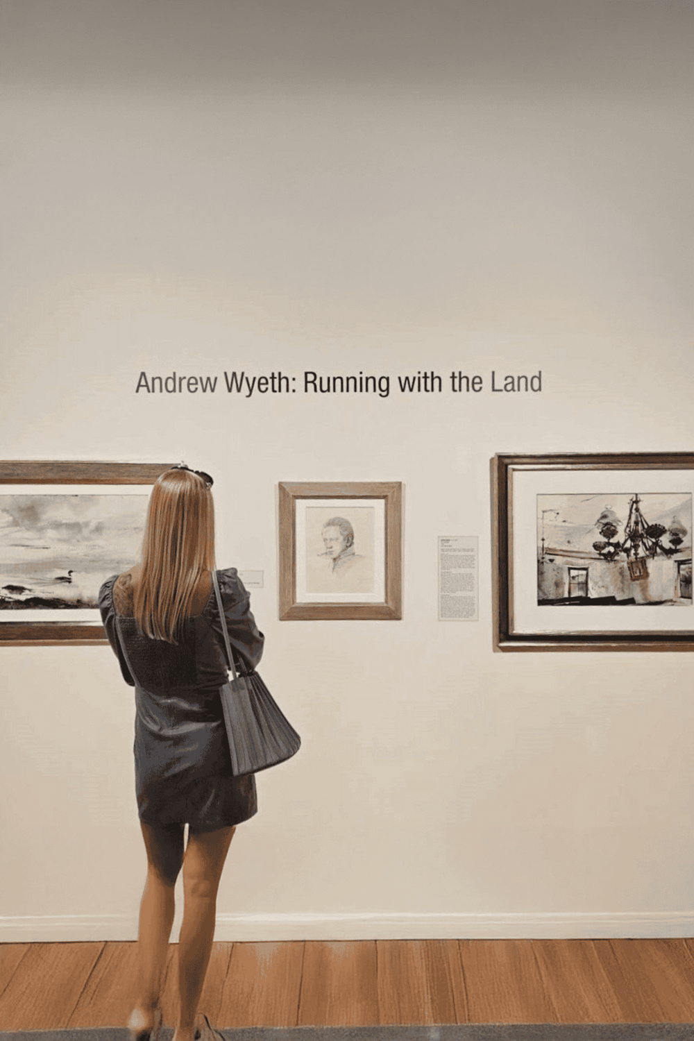 Elegant art gallery display featuring Andrew Wyeth's "Running with the Land" at QuestForDirections museum.