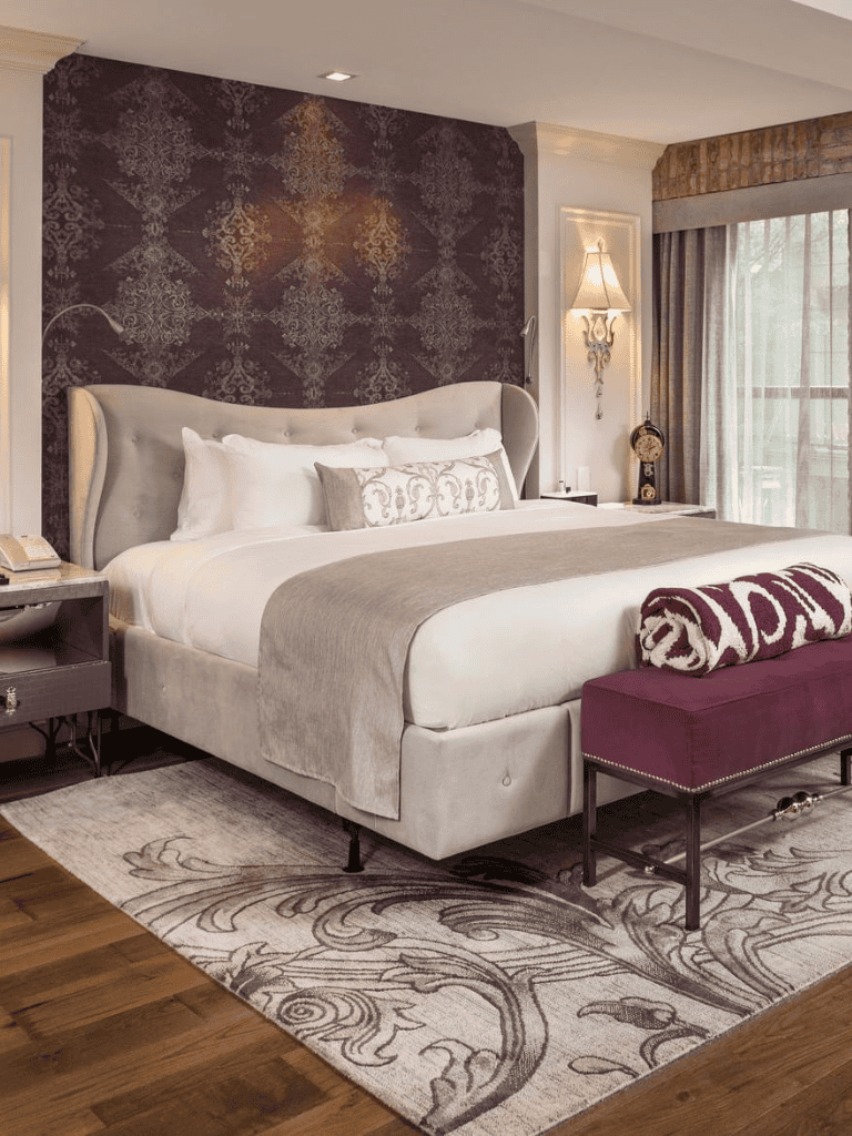 Luxurious hotel bedroom with elegant decor and cozy ambiance.