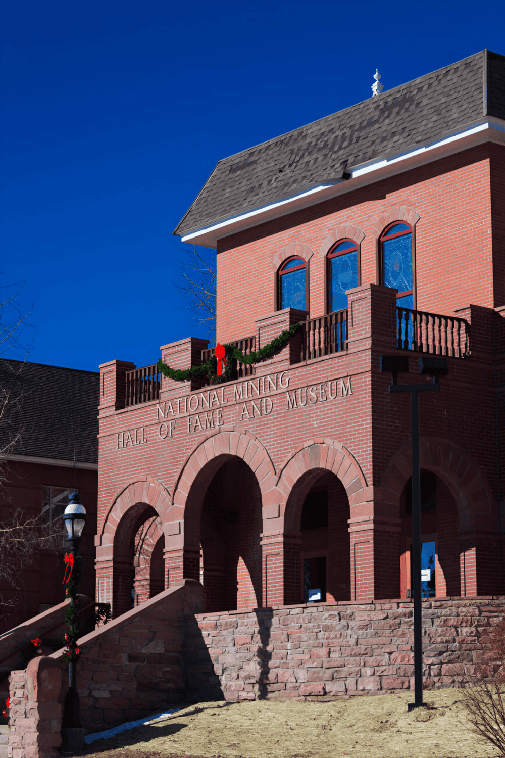 Historic brick building at the National Mining Hall of Fame and Museum, showcasing mining history and heritage.