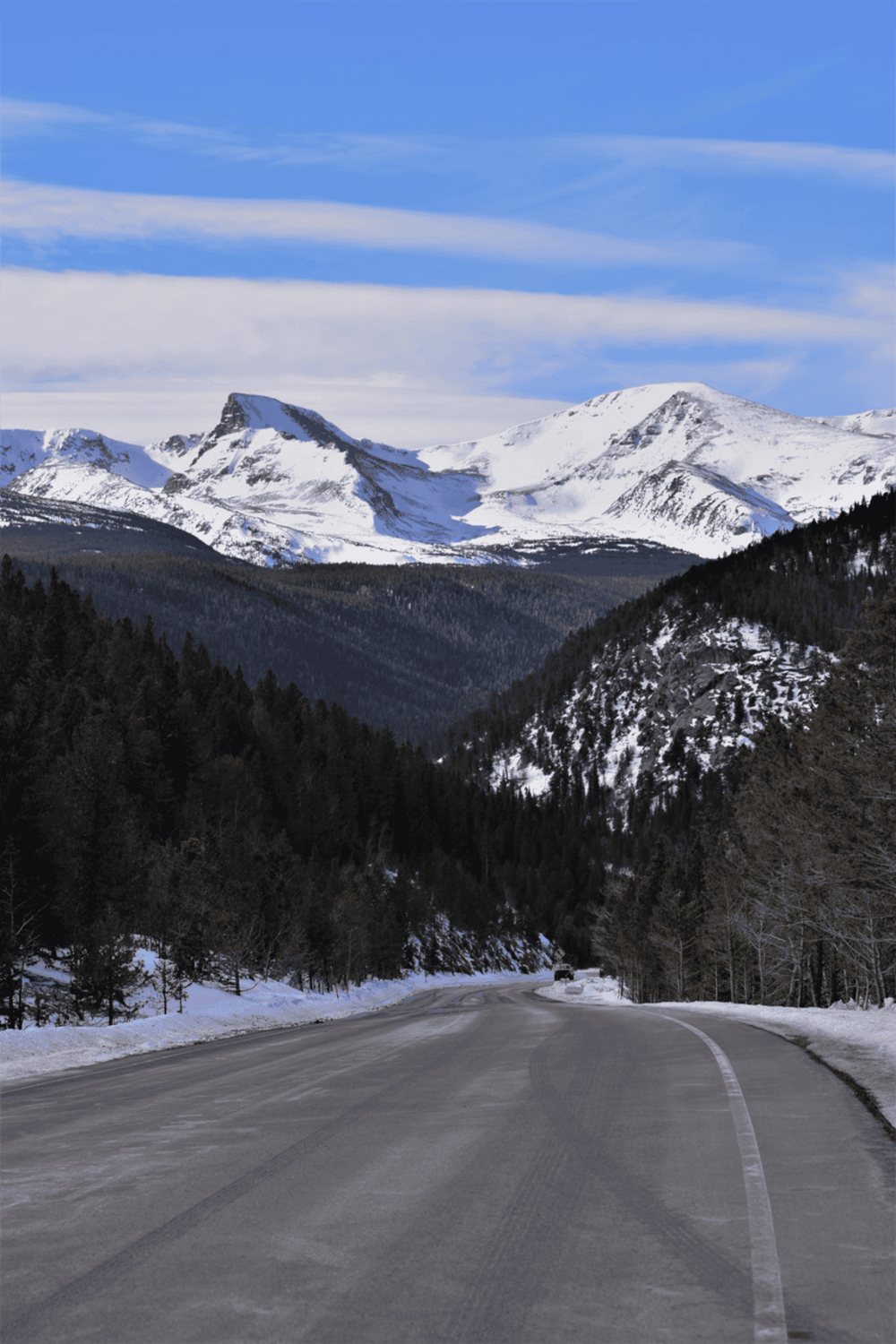 Snow-capped mountains and scenic mountain road in the Pacific Northwest.