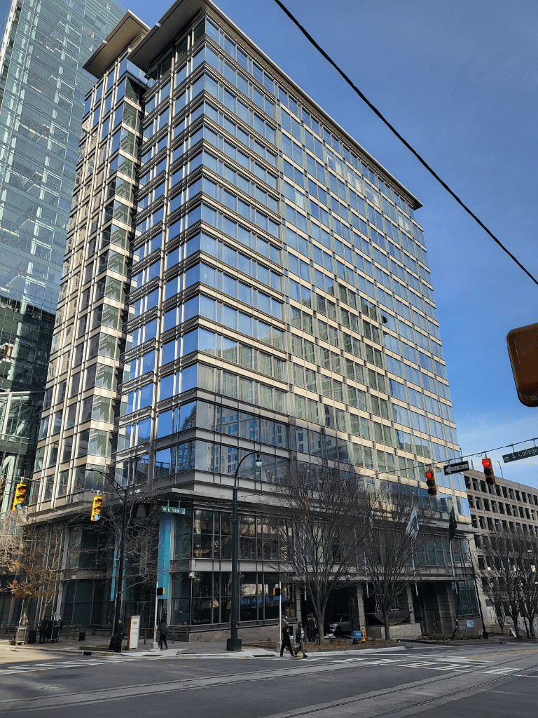 Modern downtown office building with glass facade for strategic directions.