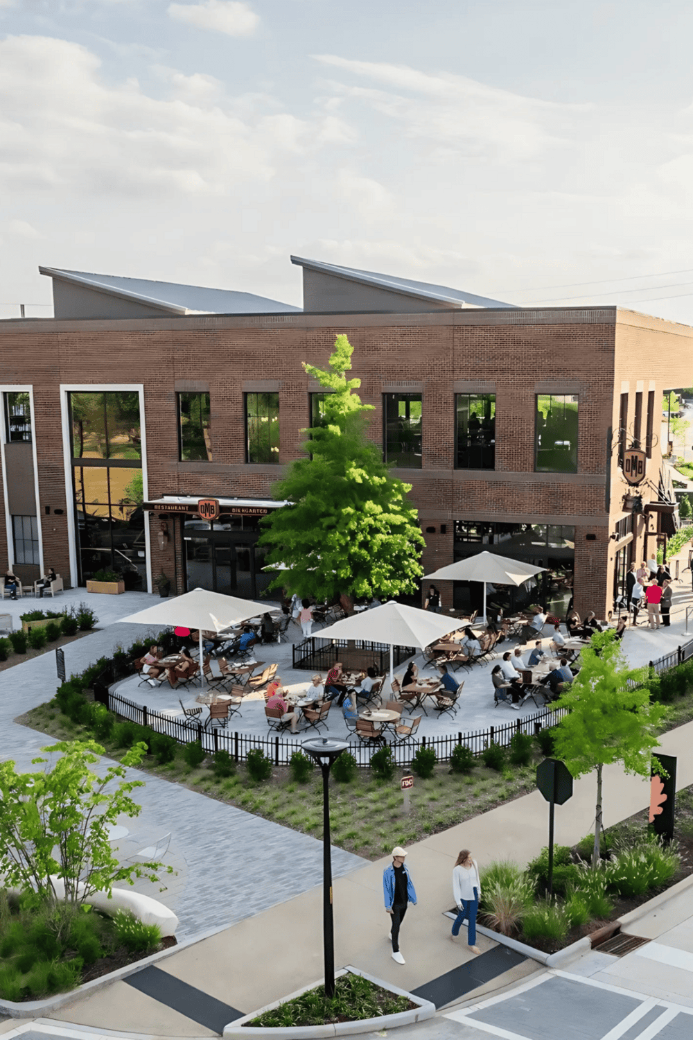 Outdoor dining area with umbrellas at QuestForDirections shopping center.