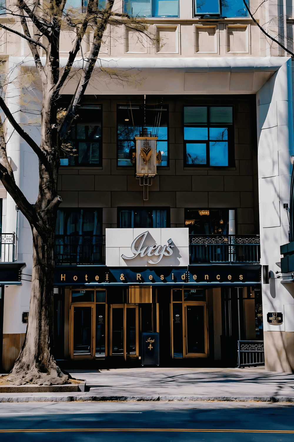 Elegant hotel entrance with modern design and signage, ideal for travelers seeking luxury accommodations.