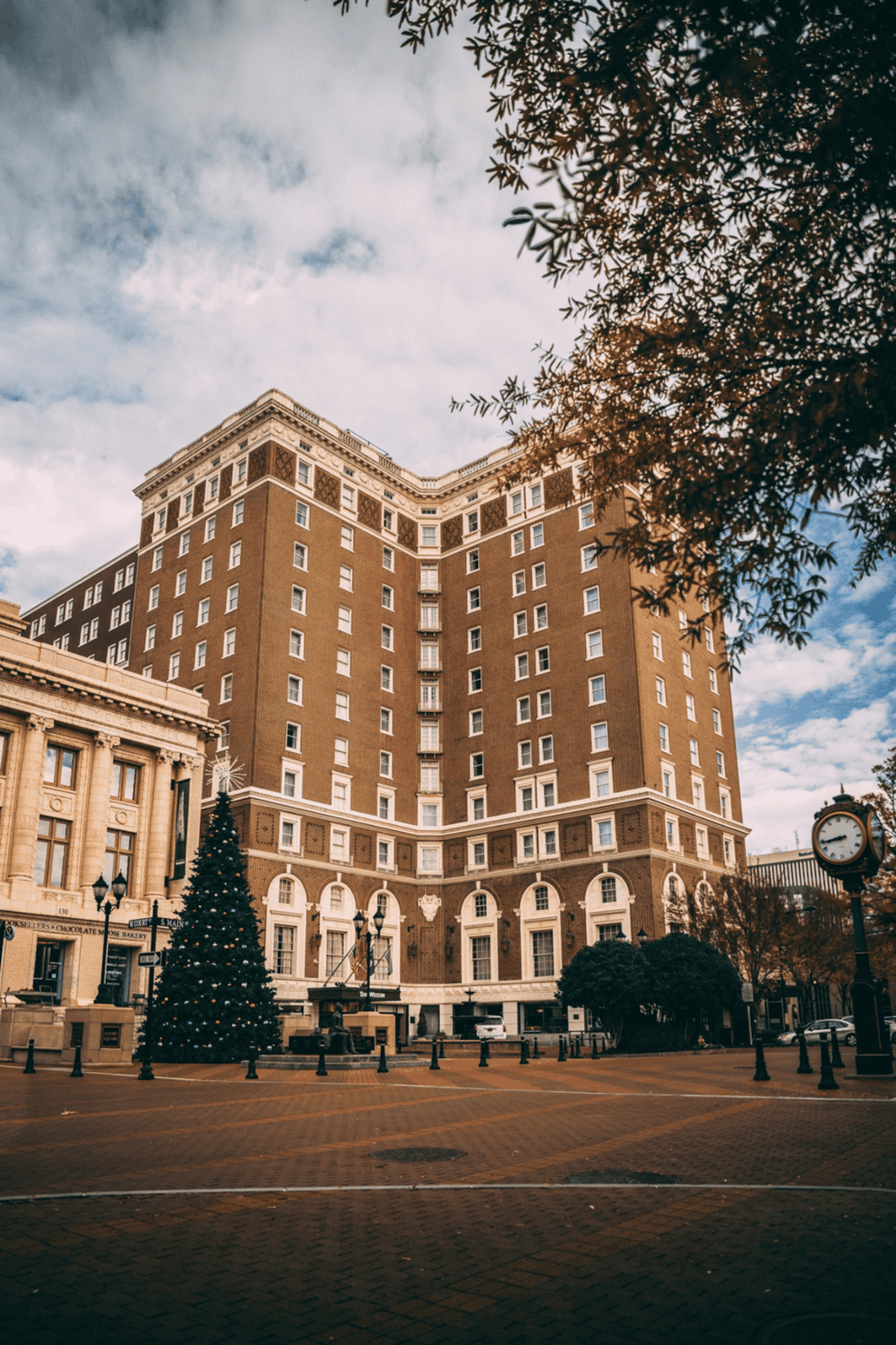 Historic downtown hotel with Christmas decorations and classic architecture.