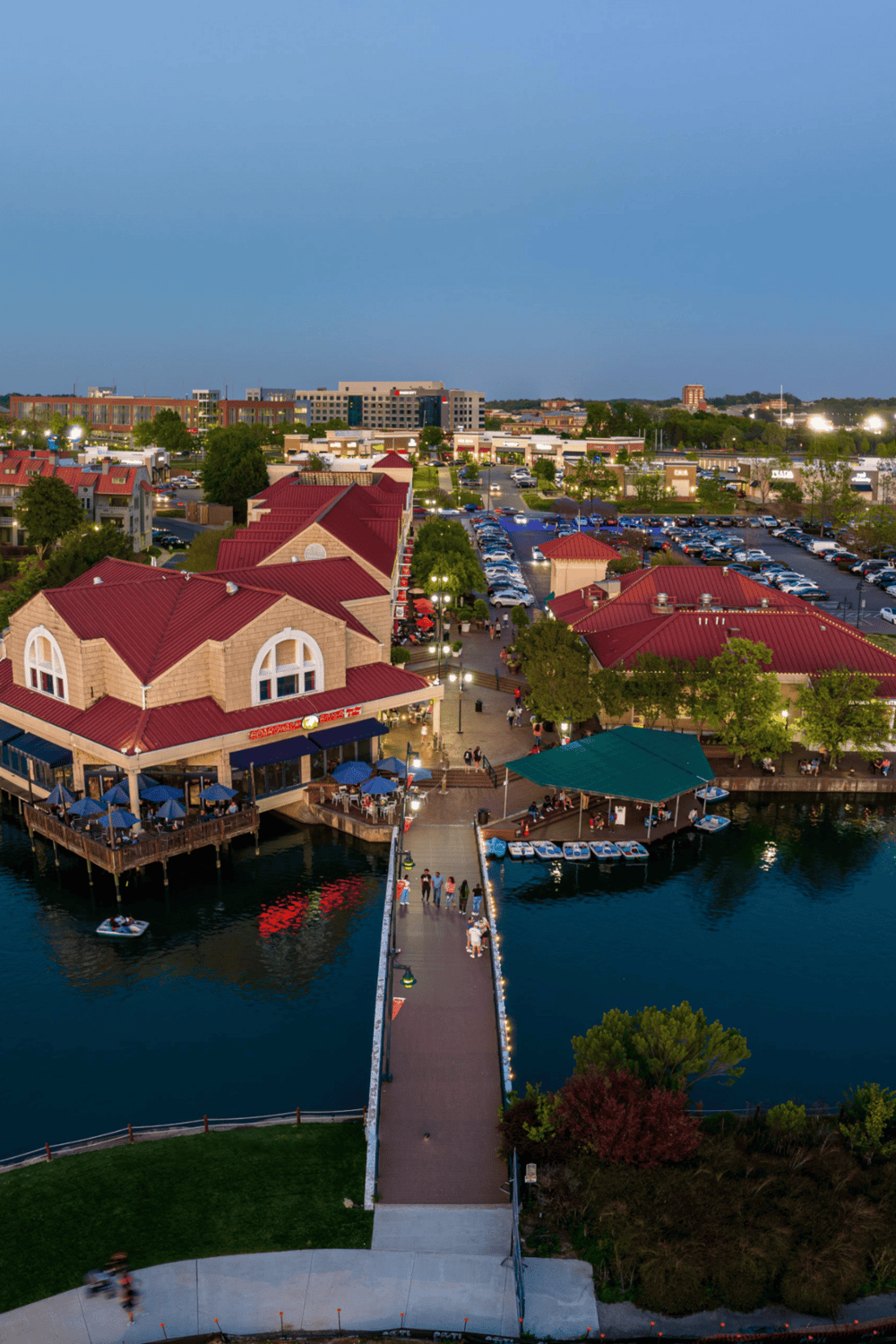 Vibrant waterfront shopping and dining area with scenic views and lively atmosphere.