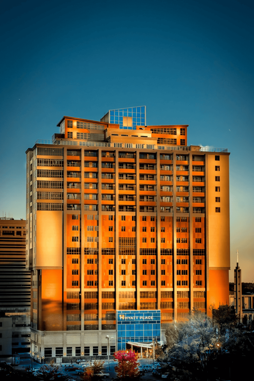 Downtown Hyatt Place hotel building during sunset, modern architecture, cityscape, urban hospitality.