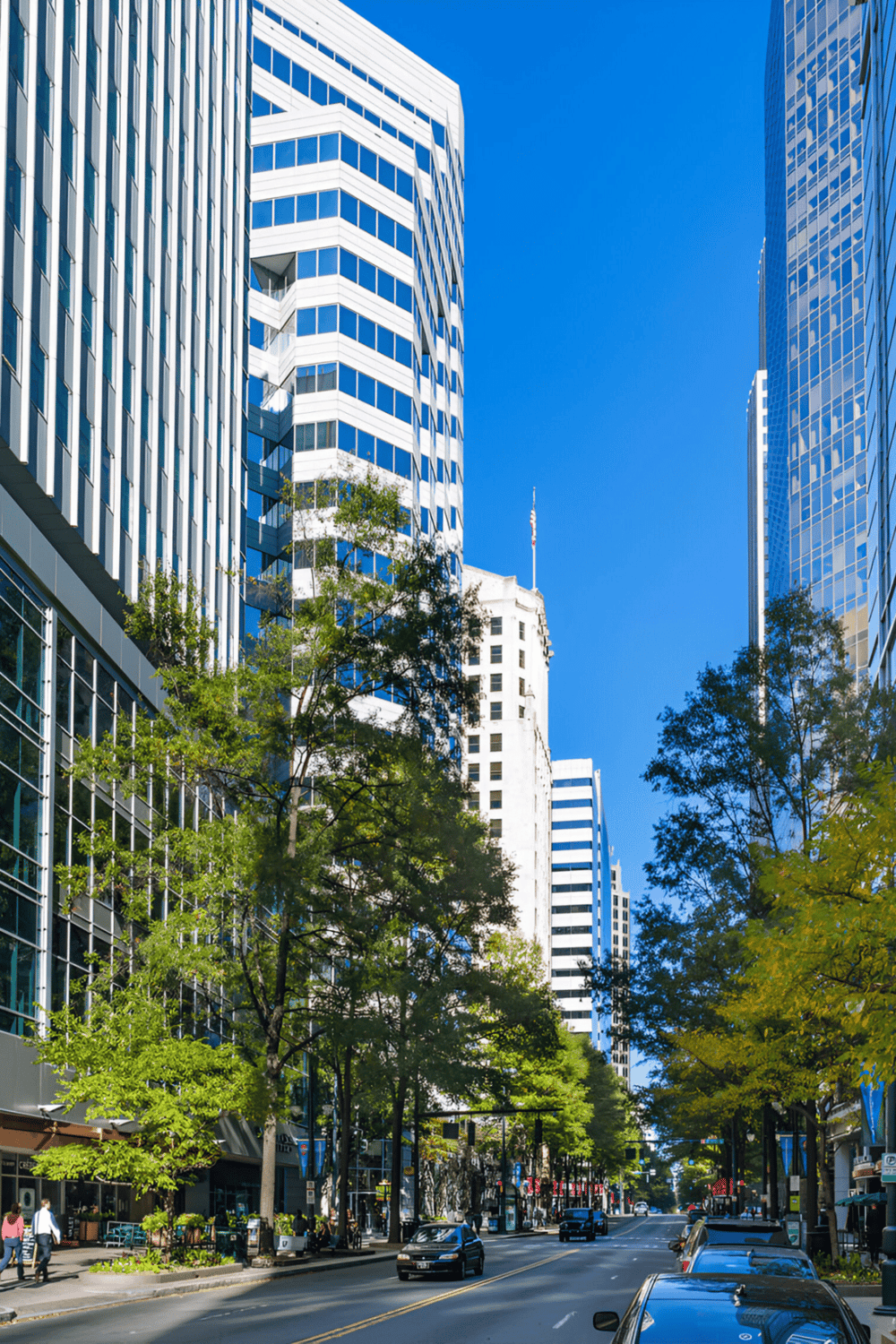 Modern city skyscrapers with glass facades in downtown area.