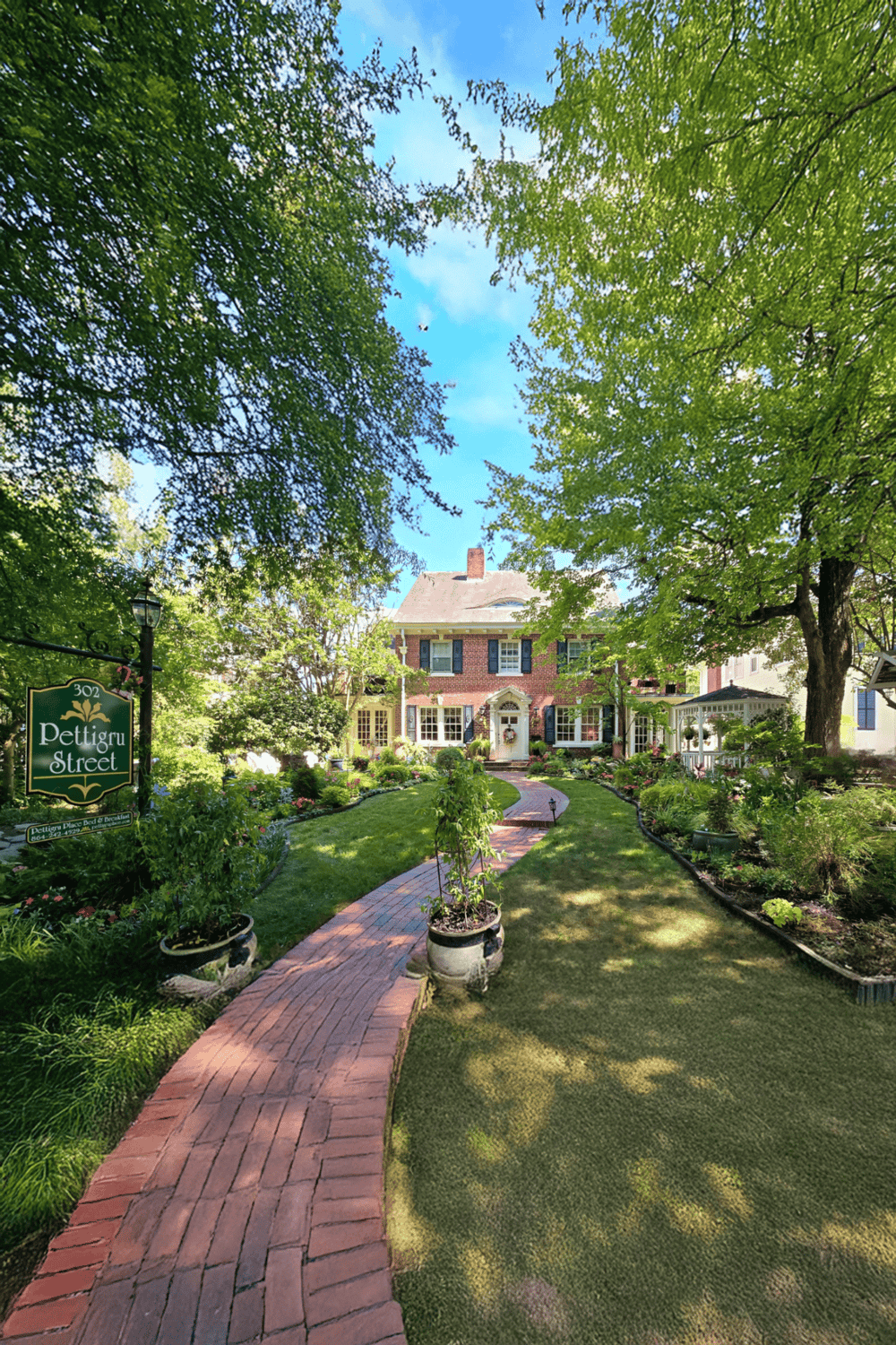 Charming historic house surrounded by lush gardens on Pettigru Street, Greenville, SC.