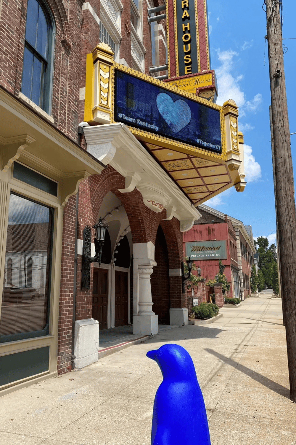 Colorful marquee and theater entrance in downtown, highlighting QuestForDirections.