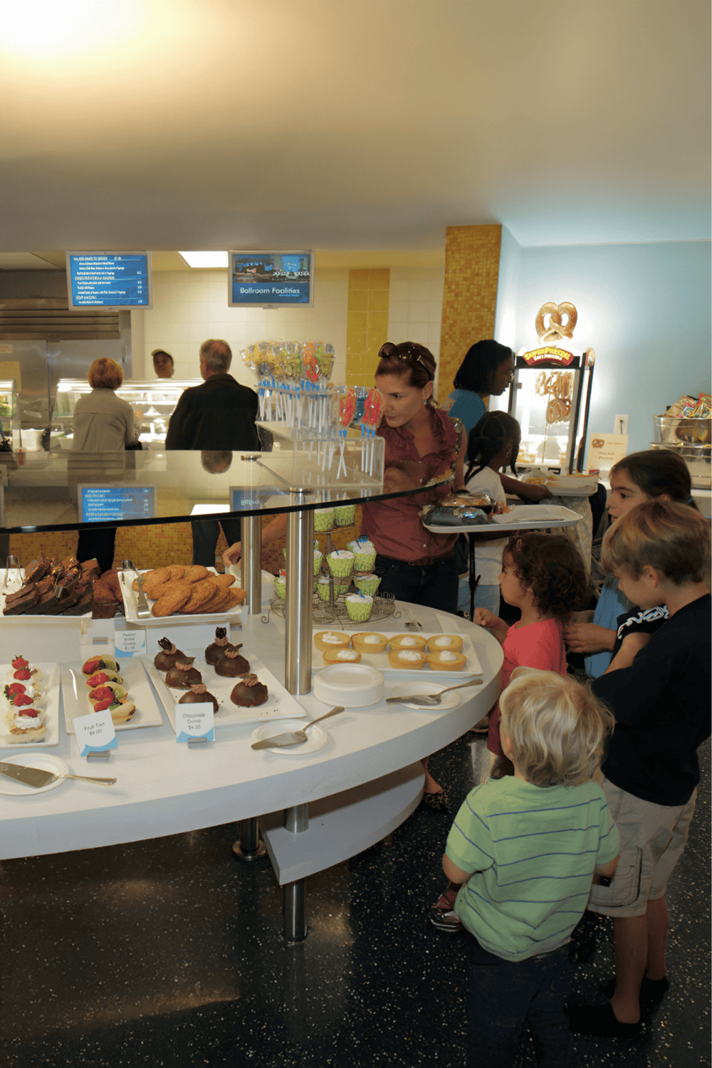 Light-up dessert buffet at QuestForDirections; kids and adults enjoying sweet treats at a family-friendly event.