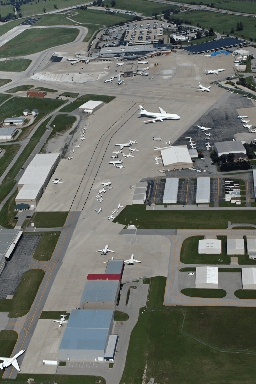 Airplane hangar and aircraft parking at Quest for Directions airport.