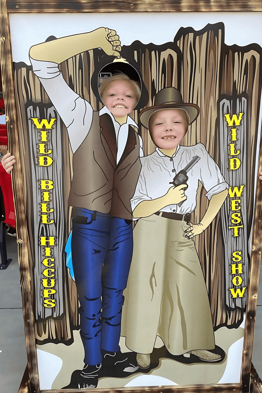 Children playing dressed as wild west cowboys at a fun photo booth, perfect for western-themed events and family entertainment.