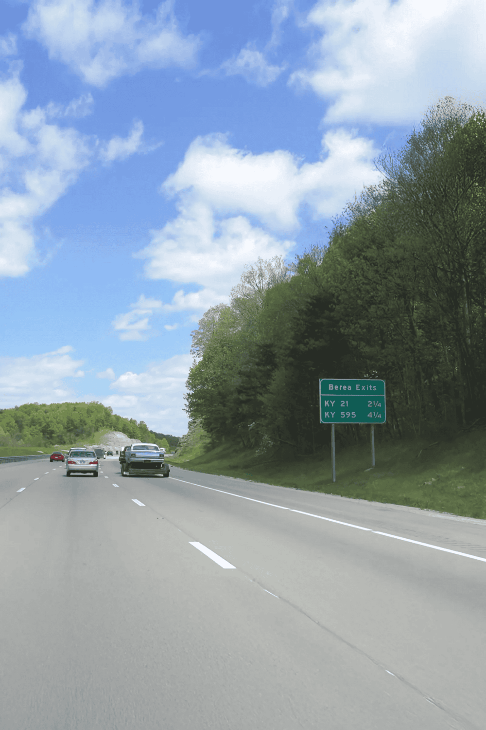 Highway exit sign for Berea, Kentucky, with directions to KY 21 and KY 595, scenic drive, travel directions, Kentucky roads, outdoor adventure, road trip.